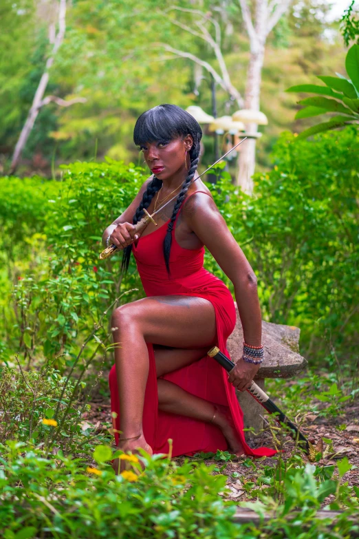 a woman in a red dress sitting on a bench, an album cover, pexels contest winner, holding a spear, ebony skin, jamaica, model pose