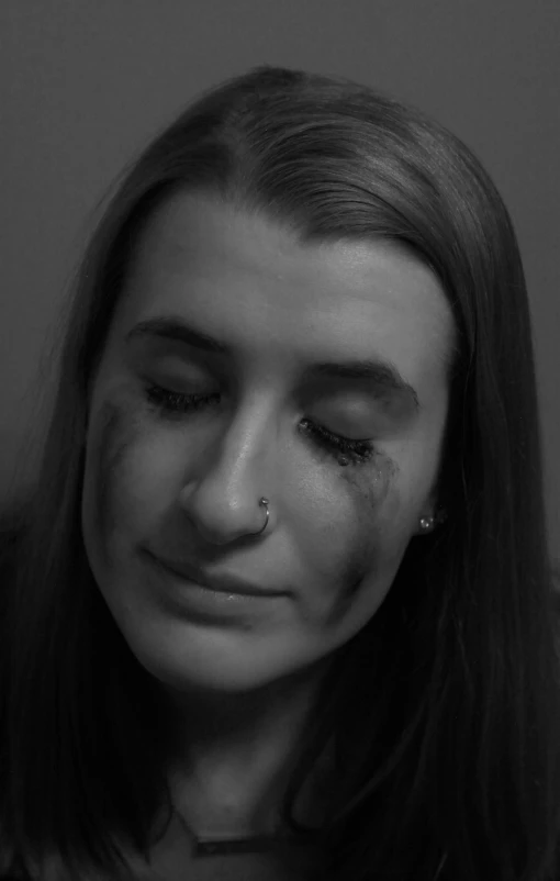 a black and white photo of a woman with bruises on her face, a black and white photo, inspired by Hannah Frank, reddit, crying big blue tears, still from a music video, alex heywood, max dennison