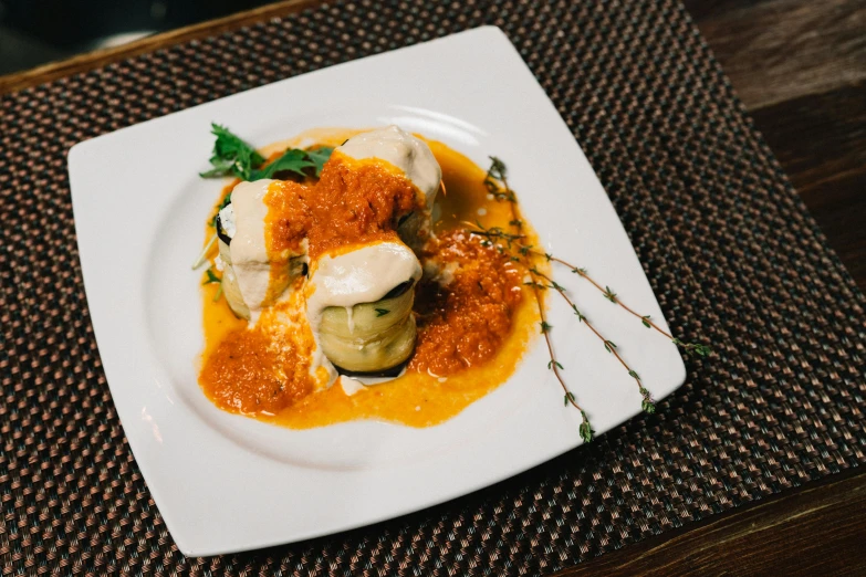 a close up of a plate of food on a table, basil gogos, stuffed, fibbonacci, local foods