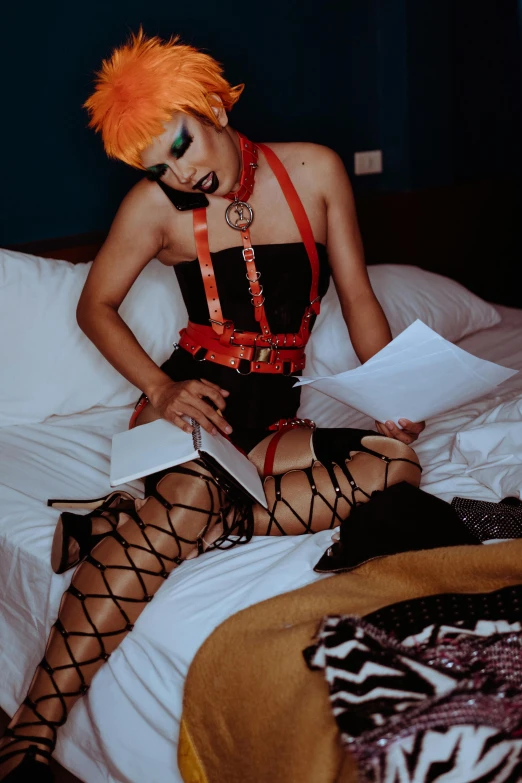 a woman with orange hair sitting on a bed, an album cover, inspired by Nan Goldin, reddit, visual art, intricate wet latex suspenders, holding spell book, wearing a punk outfit, 2019 trending photo