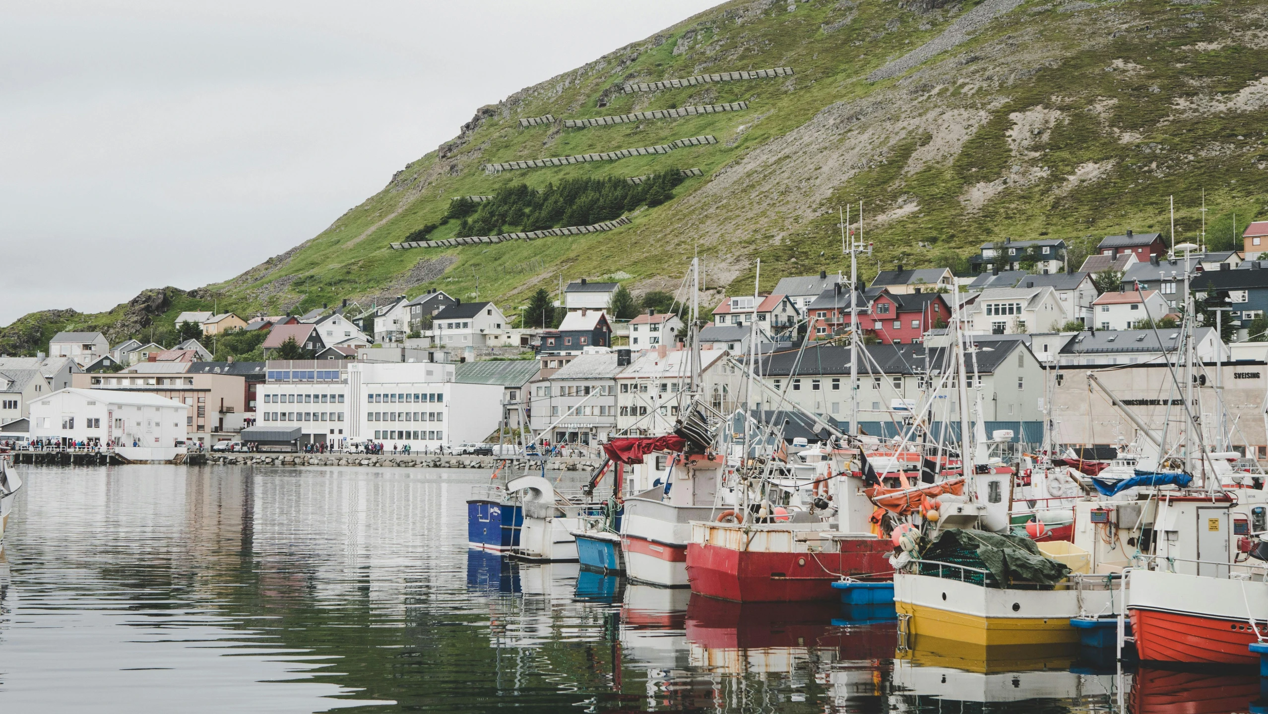 a number of boats in a body of water, a photo, by Terese Nielsen, pexels contest winner, hurufiyya, fishing town, lo fi colors, balaskas, 2000s photo