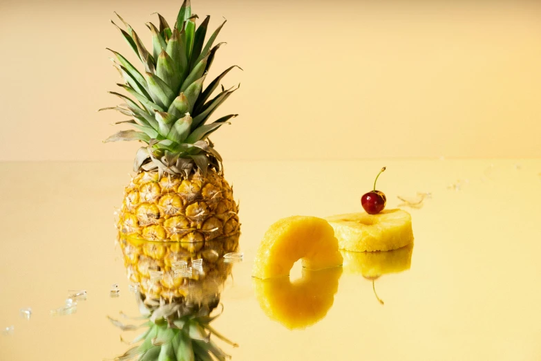 a pineapple sitting on top of a table next to a piece of fruit, reflection, product shot, dessert, polished