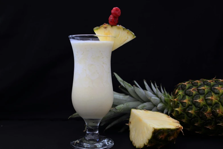 a glass filled with a drink next to a pineapple, milky white skin, avatar image, fan favorite, dessert