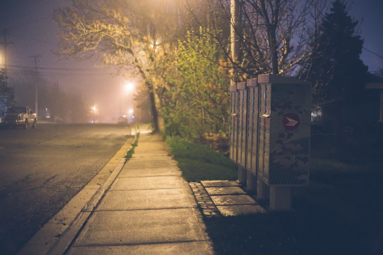 a street light sitting on the side of a road, a picture, unsplash, graffiti, photography of gregory crewdson, suburb, on a sidewalk of vancouver, hazy and dreary