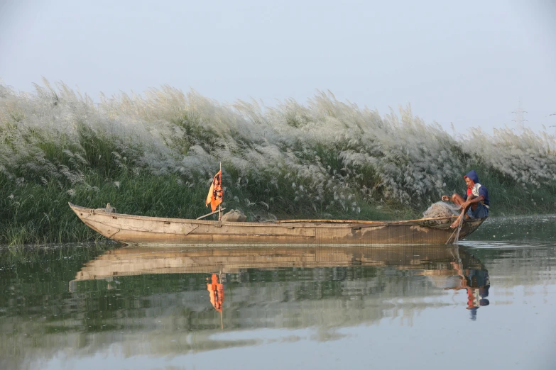 two people in a small boat on a body of water, by Jan Tengnagel, hurufiyya, baotou china, maintenance photo, slide show, thumbnail