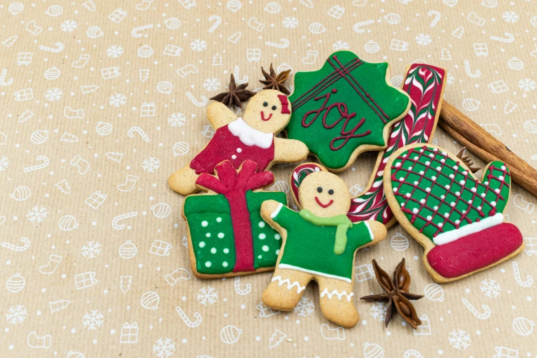 a couple of cookies sitting on top of a table, a picture, red and green, listing image, background image, ornaments