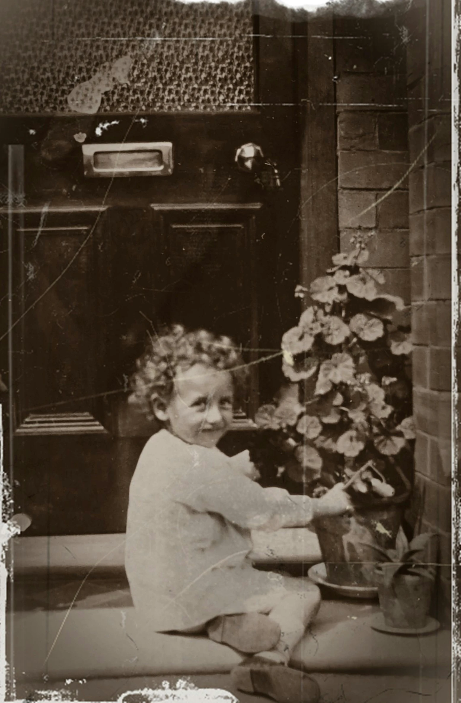 an old black and white photo of a child, australian tonalism, gardening, 1920's london street, instagram picture, robert plant