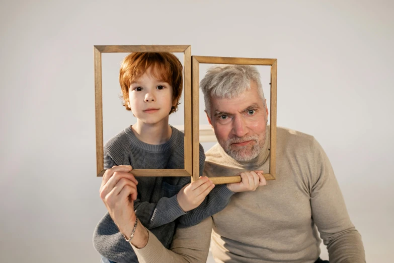 a man holding a child in front of a mirror, a picture, pexels contest winner, hyperrealism, square pictureframes, an old man with a ginger beard, characters 8k symmetrical, bo burnham