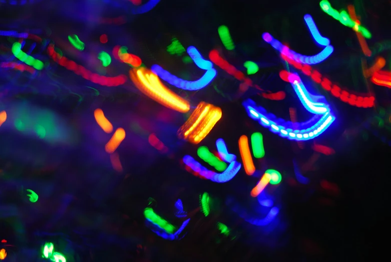 a bunch of lights that are in the dark, a microscopic photo, inspired by Bruce Munro, pexels, holography, multicolor, dance club rave, taken with a canon eos 5d, bright glowing veins