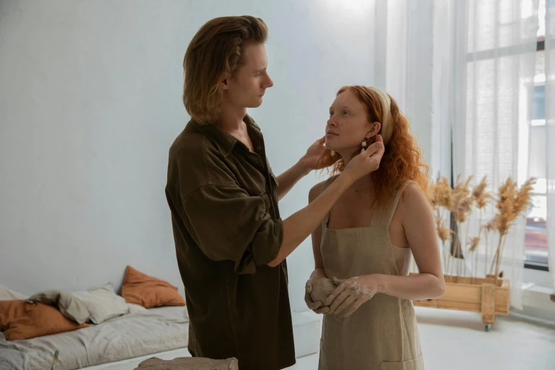 a woman standing next to another woman in a room, by Emma Andijewska, pexels contest winner, renaissance, brunette boy and redhead boy, skincare, sculpting, couple on bed