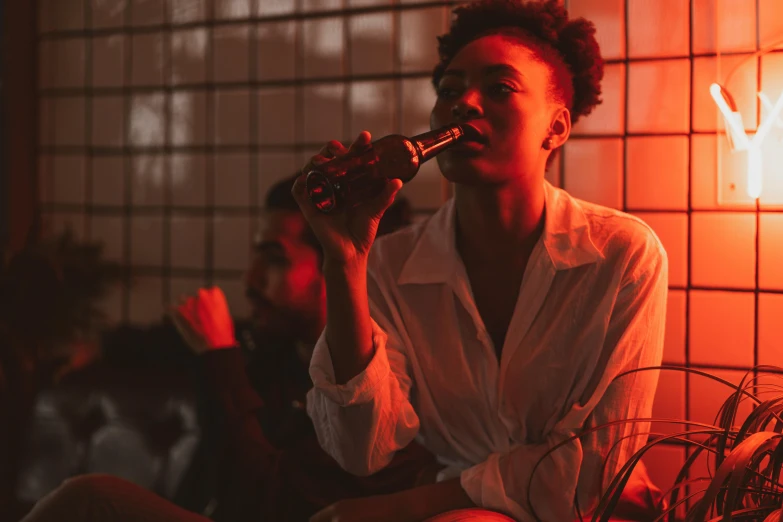 a woman smoking a cigarette in a dimly lit room, an album cover, pexels contest winner, happening, drinking a bottle of coca-cola, african american young woman, lesbians, saturation 40