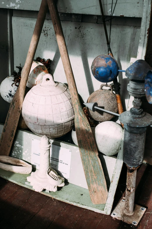 a collection of old baseball bats and balls, unsplash, assemblage, lanterns, on ship, domes, home display