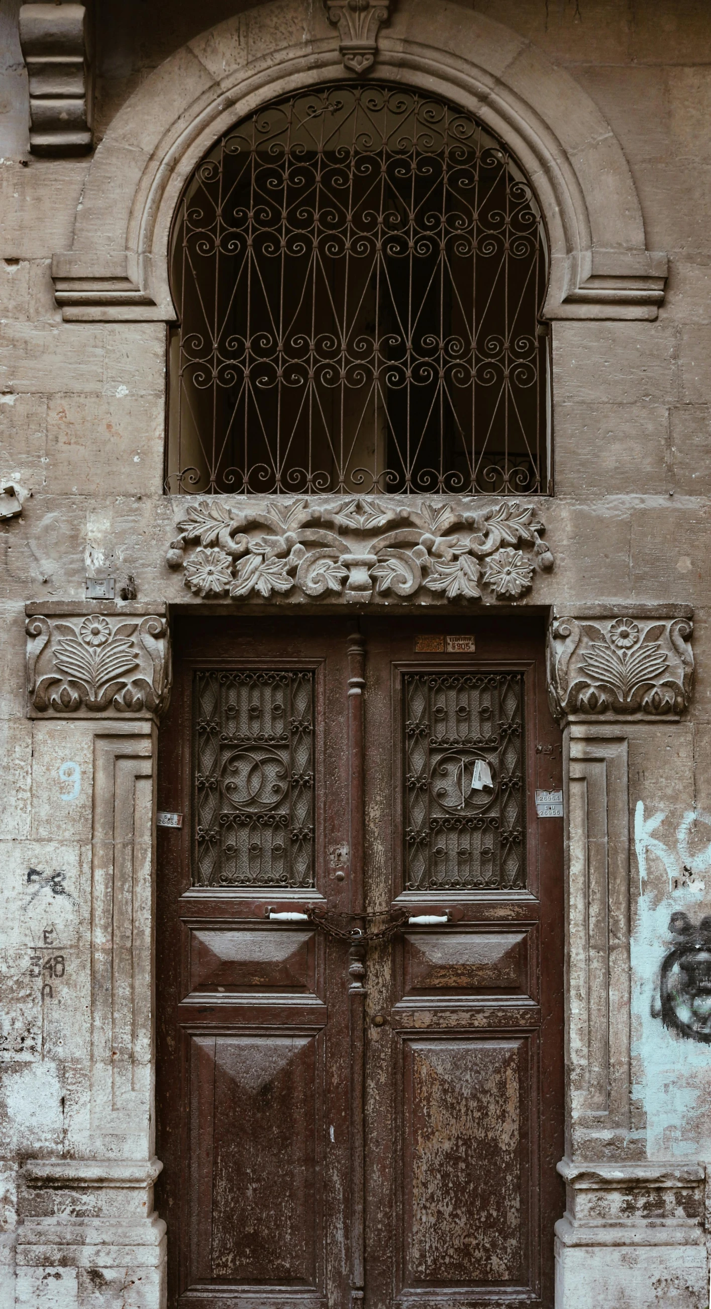a red fire hydrant sitting in front of a wooden door, pexels contest winner, art nouveau, symmetrical doorway, antoni tapies and cy twombly, brown:-2, old building