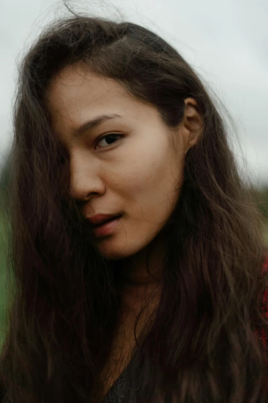 a close up of a person with long hair, pexels contest winner, south east asian with round face, mixed race woman, portrait rugged girl, cheekbones