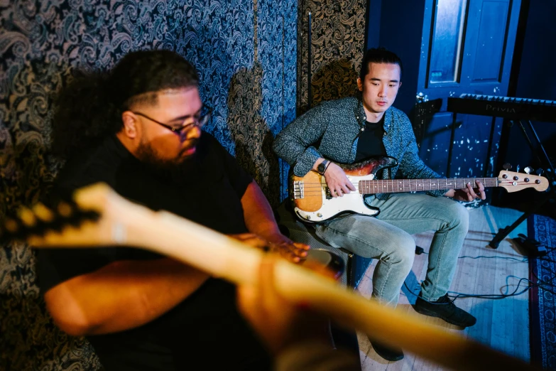 two men sitting next to each other playing guitars, an album cover, unsplash, zeen chin and terada katsuya, background image, bowater charlie and brom gerald, thumbnail