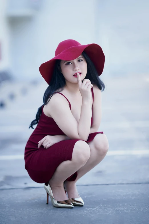 a woman in a red dress and a red hat, inspired by Cheng Jiasui, pexels contest winner, casual pose, square, pouting, dang my linh