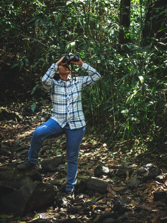 a man taking a picture of himself in the woods, by Gwen Barnard, sumatraism, wearing a flannel shirt, full body pose, 👰 🏇 ❌ 🍃, binoculars