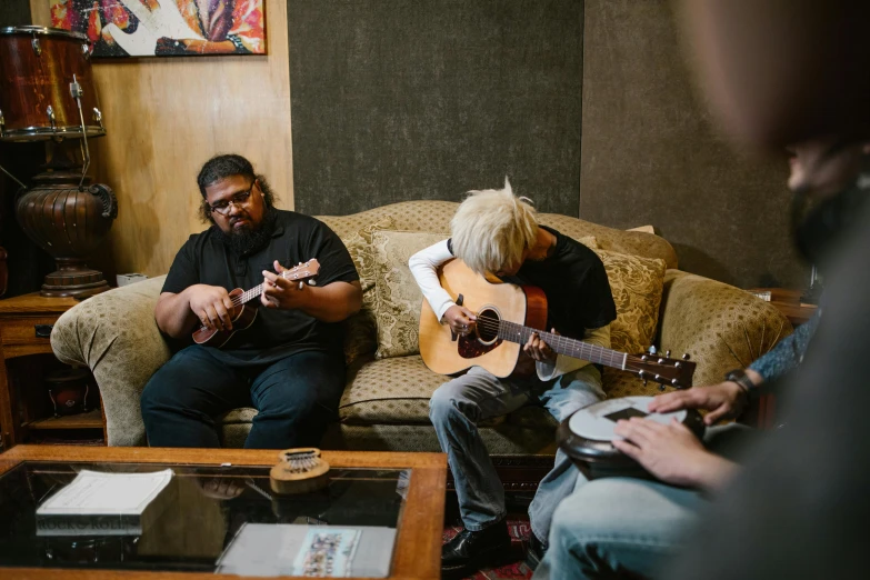 a group of people playing guitars in a living room, hurufiyya, lee madgwick & liam wong, kyoani studio, a blond, maintenance photo