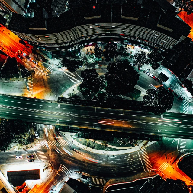 an aerial view of a city at night, by Adam Marczyński, intersection, thumbnail, pov photo, instagram post