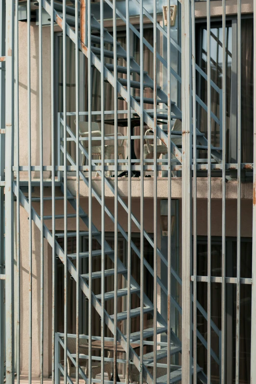 a red fire hydrant sitting in front of a building under construction, an album cover, inspired by Donald Judd, conceptual art, metal bars, 1 staircase, close - up photograph, white steel