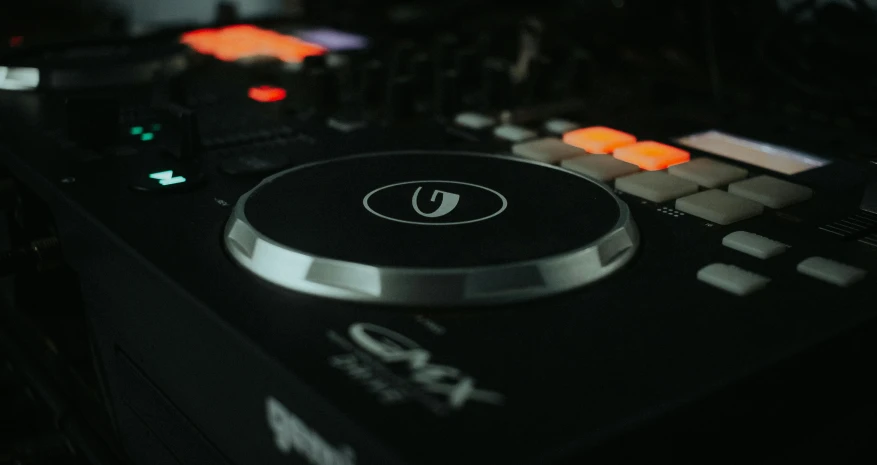 a dj controller sitting on top of a table, by An Gyeon, trending on pexels, octane sharp cinematic, bottom angle, round format, detailed product image