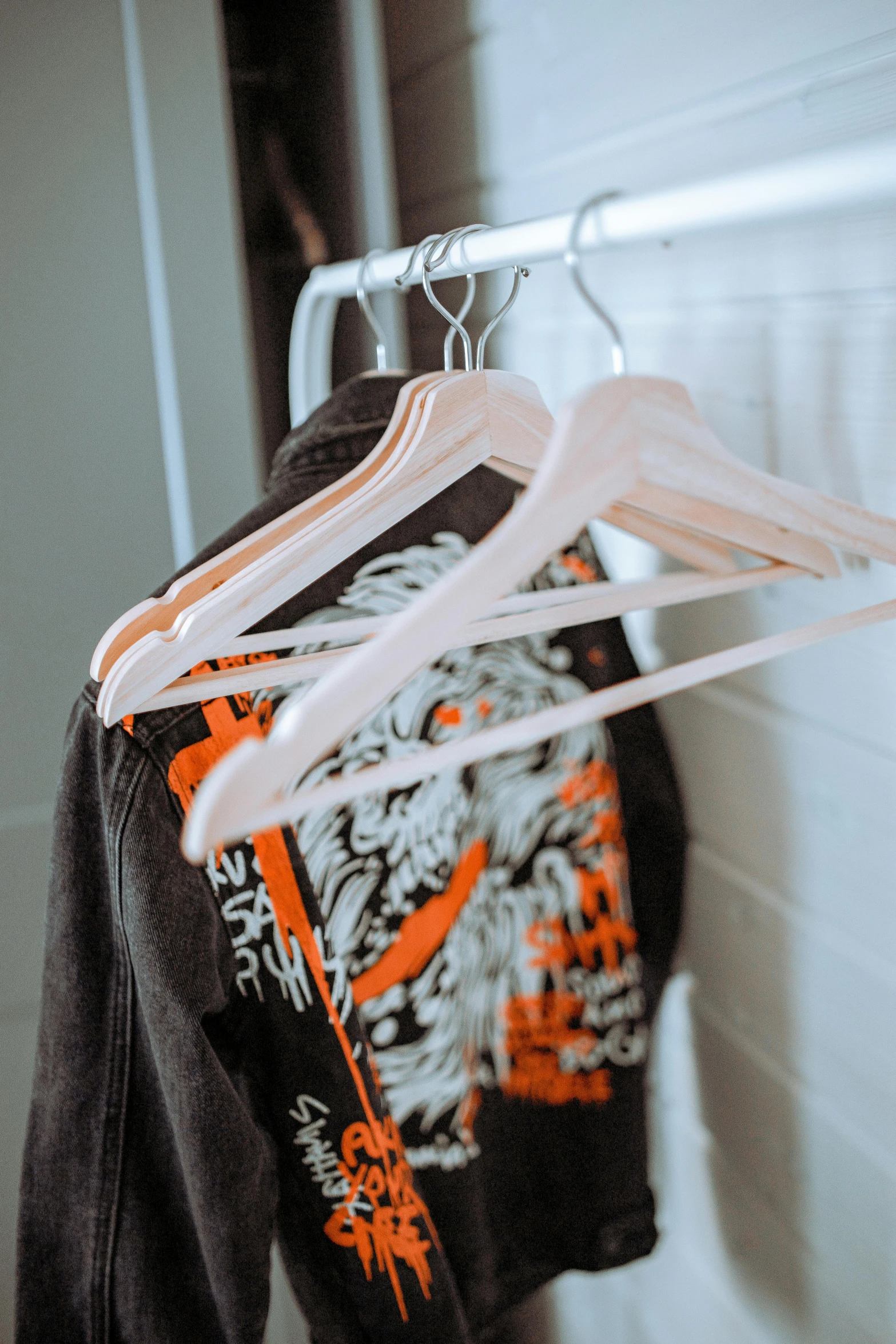 a jacket hanging on a clothes rack in a bathroom, a cartoon, unsplash, heron preston, pirate clothes, profile image, loose - fitting blouses