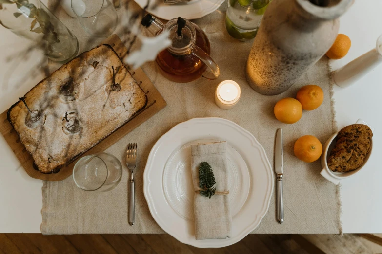 a white plate sitting on top of a table, by Carey Morris, pexels contest winner, renaissance, hygge, linen canvas, festive atmosphere, full face