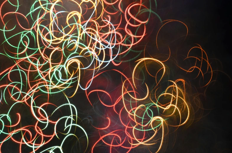 a blurry picture of a bunch of lights, pexels, generative art, fine swirling lines, scribbled, swirles, festive colors