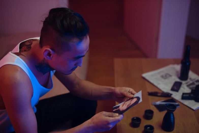 a woman sitting at a table looking at her cell phone, a picture, by artist, pexels contest winner, hyperrealism, frank dillane as puck, cardistry, justin sun, scanning items with smartphone