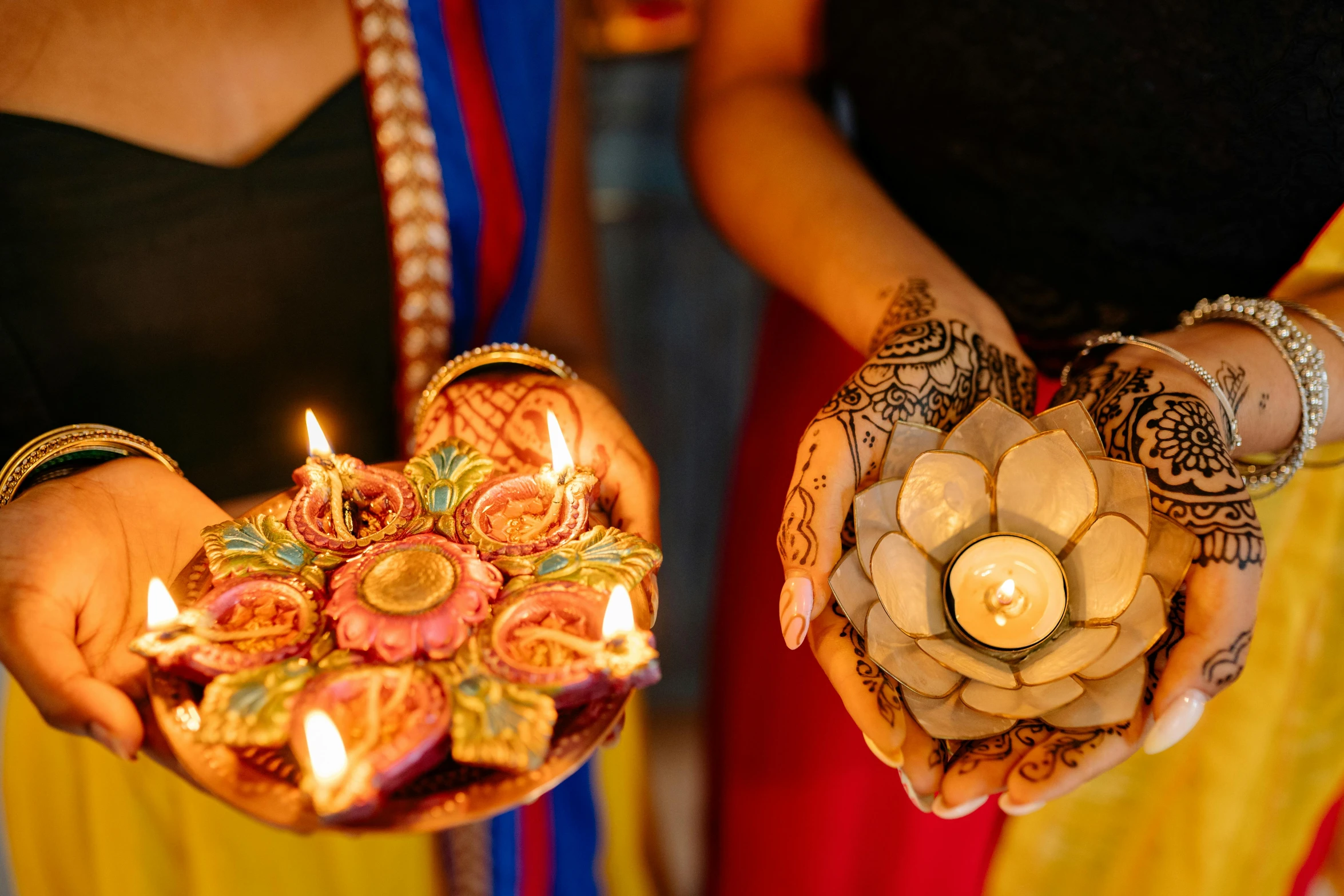 two women holding lit candles in their hands, trending on unsplash, hurufiyya, hindu ornaments, lotuses, 15081959 21121991 01012000 4k, multi colour