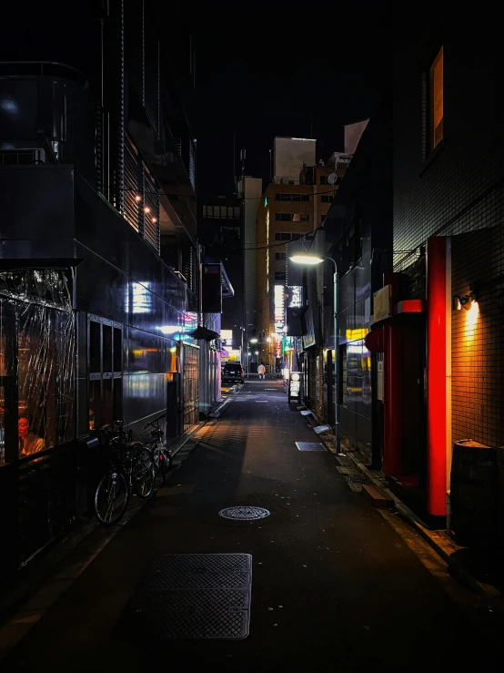 a narrow city street is lit up at night, unsplash contest winner, ukiyo-e, deserted shinjuku junk, 2022 photograph, photo on iphone, spooky photo