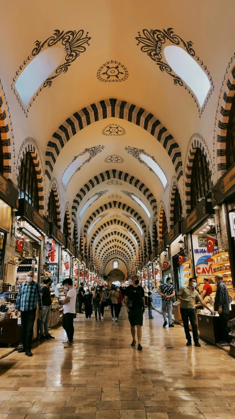 a group of people that are inside of a building, pexels contest winner, art nouveau, busy market, pointed arches, turkey, 🎀 🍓 🧚