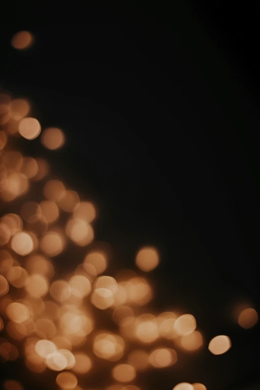 a bunch of lights that are in the dark, a picture, unsplash, light and space, black and gold colors, hasselblad film bokeh, holiday season, soft light - n 9