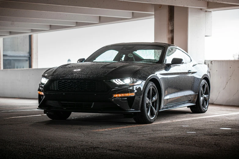 a black mustang parked in a parking garage, pexels contest winner, 🤬 🤮 💕 🎀, medium wide front shot, stealth, detailed high resolution