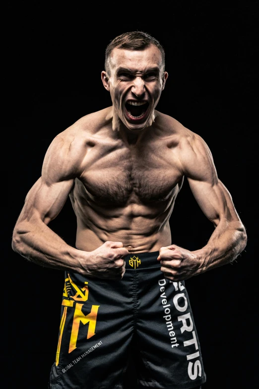 a shirtless man standing in front of a black background, inspired by ken kelly, khabib, mariusz lewandowski, official photo, hgh