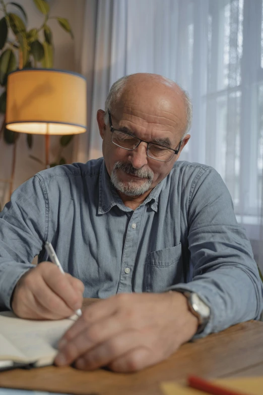 a man sitting at a table writing on a piece of paper, portrait of hide the pain harold, high quality screenshot, at home, wearing reading glasses