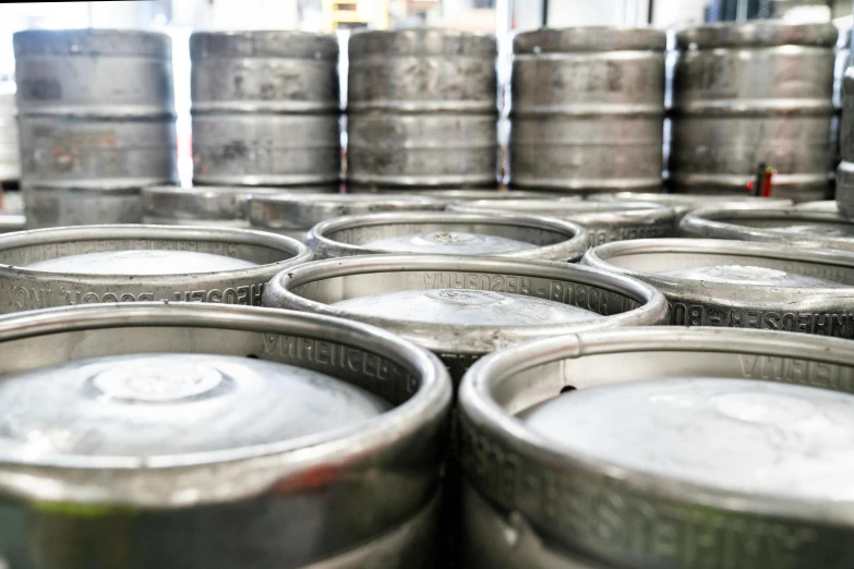 a bunch of metal kegs stacked on top of each other, dapped light, skye meaker, unblur, uploaded