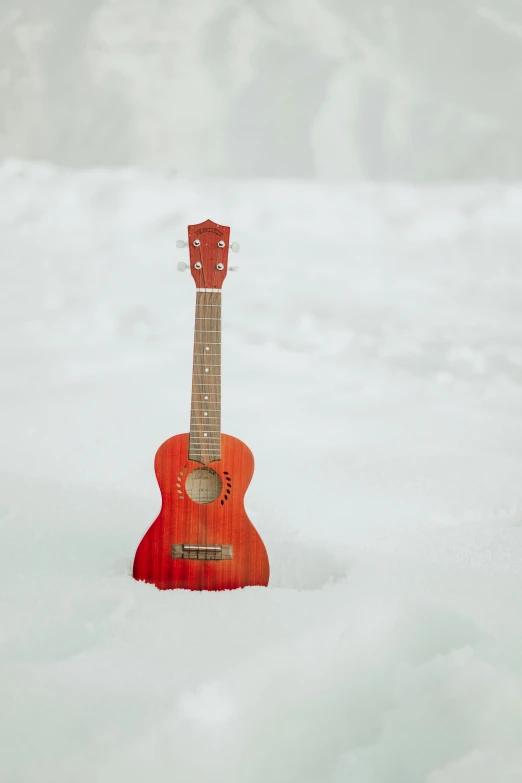 a small red guitar sitting in the snow, shutterstock contest winner, ukulele, profile picture, greg rutkowski - h 7 6 8, press shot