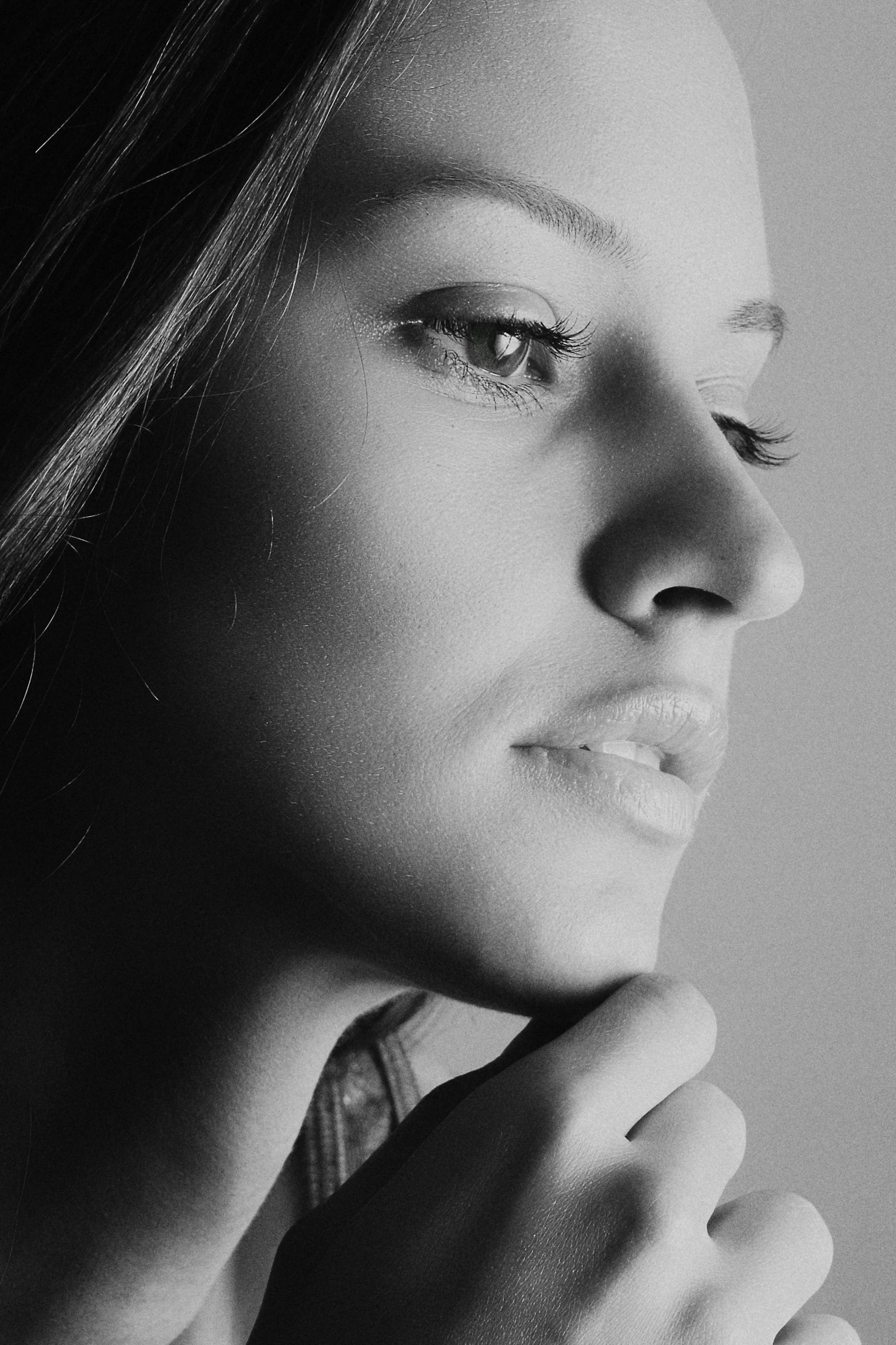 a black and white photo of a woman, inspired by irakli nadar, pexels contest winner, hyperrealism, profile pic, smooth chin, {perfect face}, taken in the late 2000s