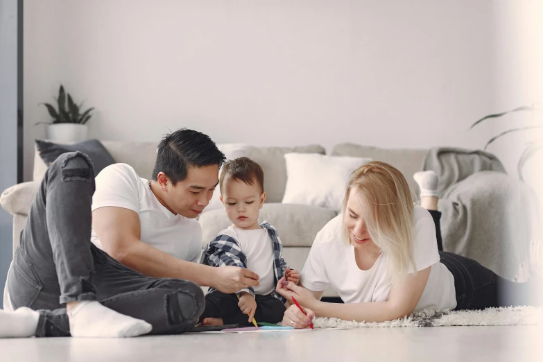 a man and woman sitting on the floor with a baby, a child's drawing, pexels contest winner, casual game, youtube thumbnail, husband wife and son, profile image