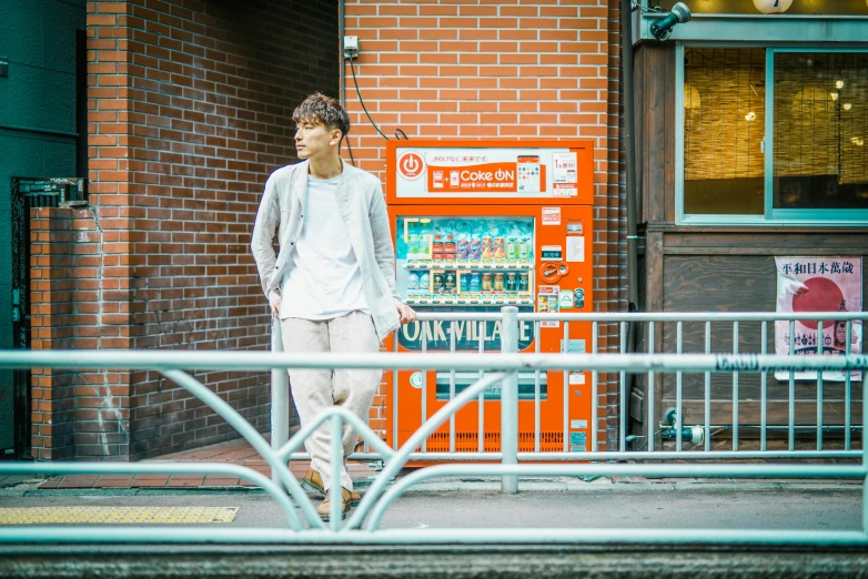 a man standing in front of a vending machine, unsplash, shin hanga, standing on street corner, yukito kishiro, full body picture, white!!