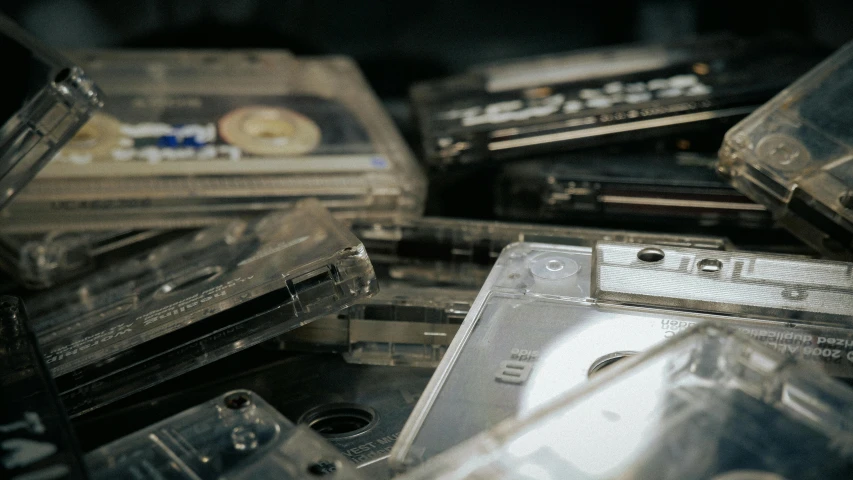 a pile of cassettes sitting on top of each other, unsplash, shiny plastic, old tape, high samples, subtle details
