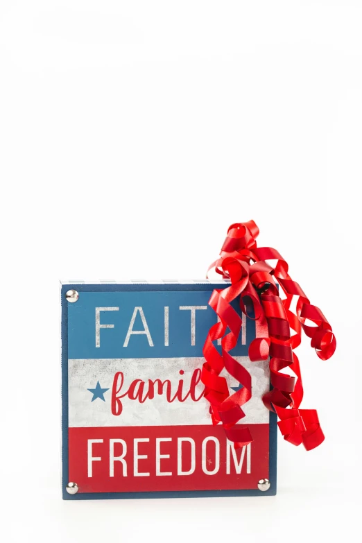 a red, white and blue sign that says faith, family, freedom, full product shot, ribbon, multi-part, small