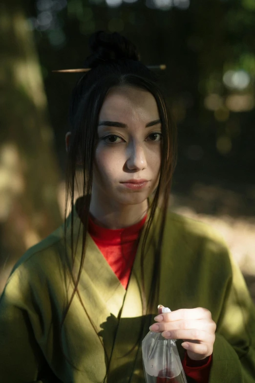 a woman in a green kimono is holding a plastic bag, a portrait, inspired by Otake Chikuha, unsplash, dilraba dilmurat, imogen poots as a holy warrior, ( ( theatrical ) ), beautiful surroundings