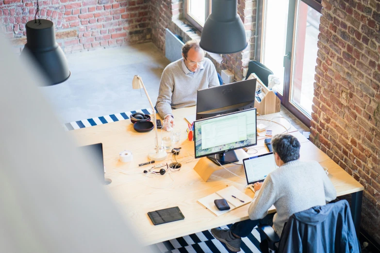 a couple of people that are sitting at a table, pexels contest winner, arbeitsrat für kunst, cubical meeting room office, maintenance photo, thumbnail, 9 9 designs