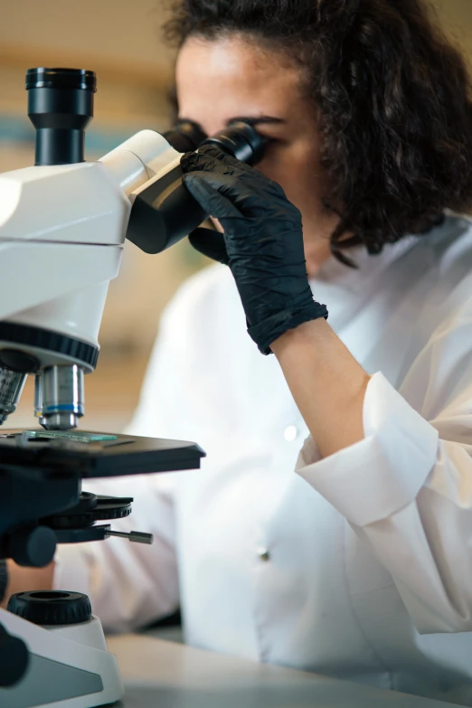 a woman in a lab coat looking through a microscope, thumbnail, inspect in inventory image, closeup shot, fan favorite