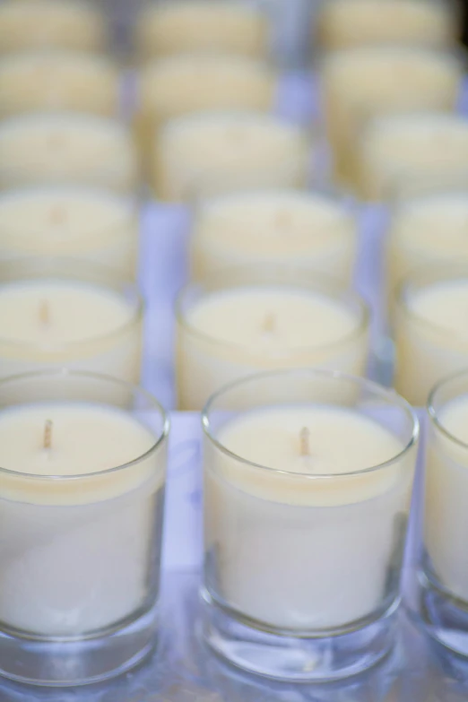 rows of candles sitting on top of a table, vanilla, high quality product image”, looking towards camera, small