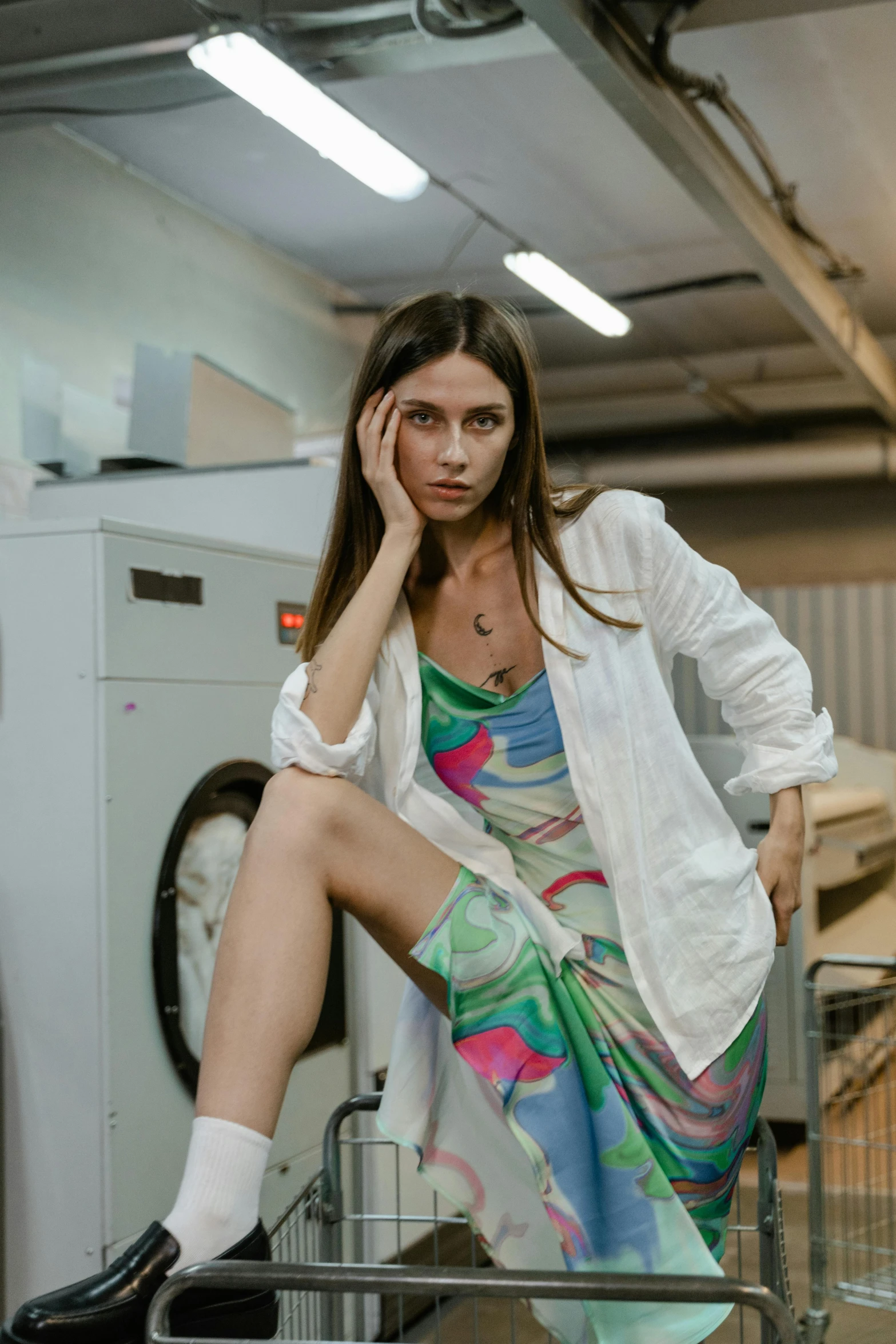 a woman sitting on top of a washing machine, a colorized photo, trending on pexels, lab coat and tee shirt, angela sarafyan, silk dress, casual modern clothing