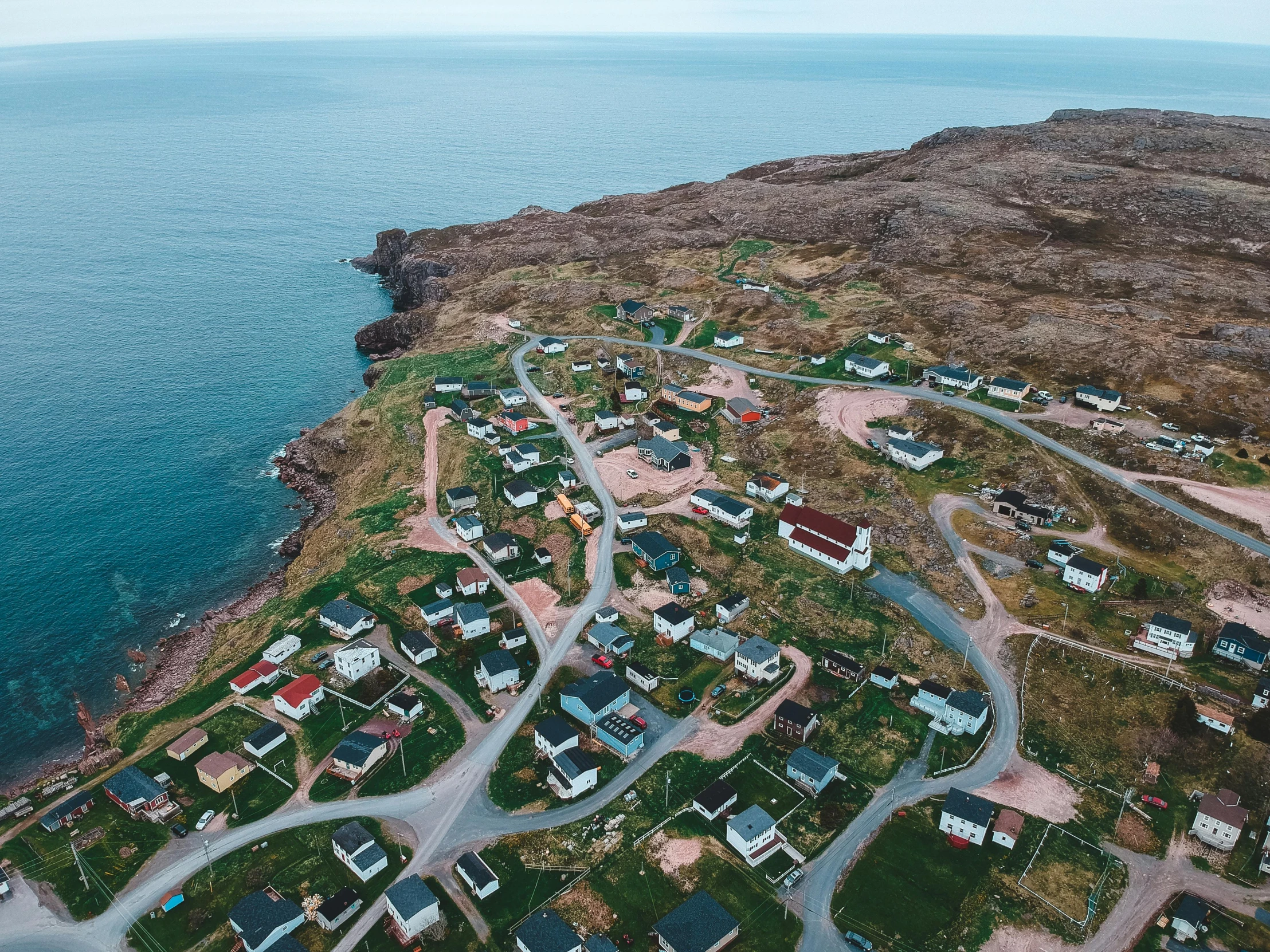 a bird's eye view of a small town next to the ocean, by Daniel Lieske, pexels contest winner, les nabis, inuit heritage, ocean cliff view, listing image, modeled