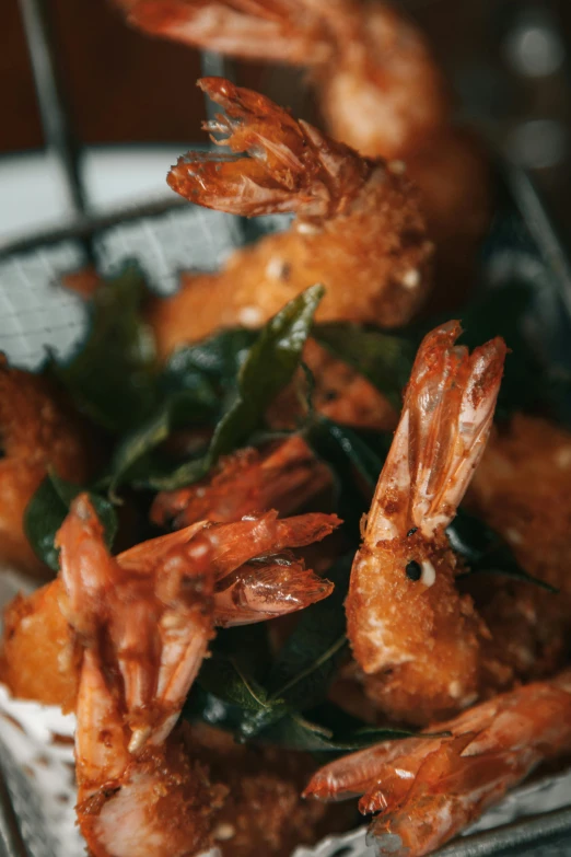 a close up of a plate of food with shrimp, deep fried, thumbnail, greens), fins